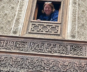 American visitor taking her picture in the Medersa of Fez